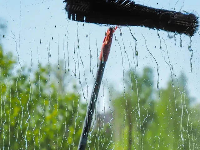 a soaked window with a red handle