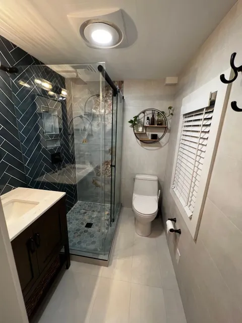 Navy herringbone bath — Reno Art Construction project