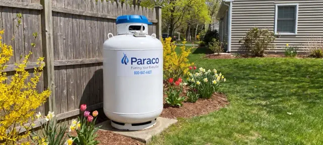 Paraco propane tank in a home yard, supplied through automatic delivery
