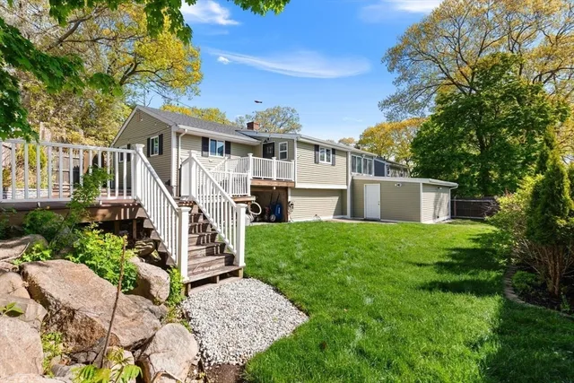 Absolutely Stunning Ward 1 Ranch! Privacy Galore On Quiet Cul-de-Sac On The Lynnfield Line! Completely Renovated 8 Room, 3 Bedroom, 2 Bathroom Home With Custom Finishes! Enormous Fireplaced Living Room With Open Concept Dining Room and Chef's Kitchen With Quartz Counters, Stainless Steel Appliances, Double Wall Oven and Plenty of Cabinets. Brand New Pergo Plus Flooring and Recessed Lighting Throughout! 3 Large Bedrooms and Renovated Full Bath Complete The Main Level.  Finished Lower Level Boasts a Media Room with Projector and Built-In Speakers, a Play Room, Full Designer Bath and Plenty of Storage Space! Enjoy Your Private Outdoor Oasis with Professionally Landscaped Yard, New Sod, Paver Patio and Large Deck, Perfect For Entertaining! Recent Updates Include Roof, Water Heater, New Pump and Expansion Tank, Carpets, and Much More! 1 Car Garage With Workshop, and 5-6 Car Parking On Paved Driveway! Minutes To Schools, Highways, Golf Course and Lynn Woods!