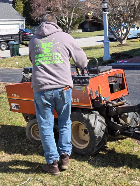 Bryan uses ditch witch trencher during residential installation for irrigation sprinkler system
