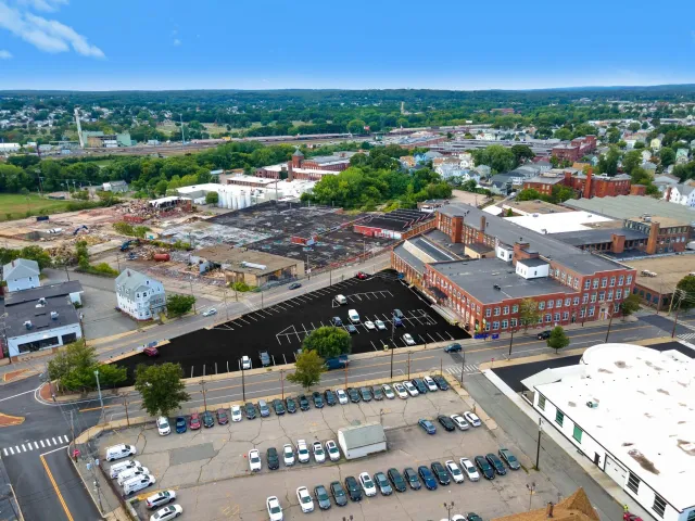 A parking lot with a lot of cars parked in it