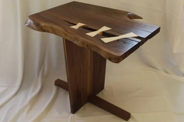 Live edge walnut side table with butterfly inlays on pedestal base in Central Connecticut by Riverbend Renovations