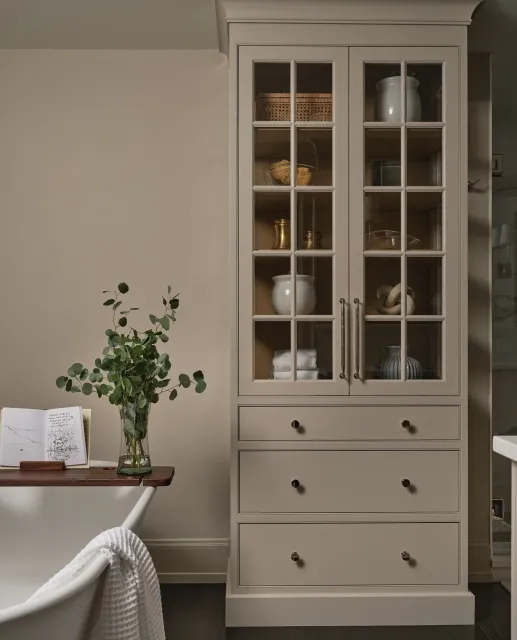 You can never have too much cabinet space in a bathroom&mdash;especially when it looks this good!

We love how the cabinetry in this primary bath is painted the same hue as the walls, creating a soft, seamless look that keeps the focus on relaxation.