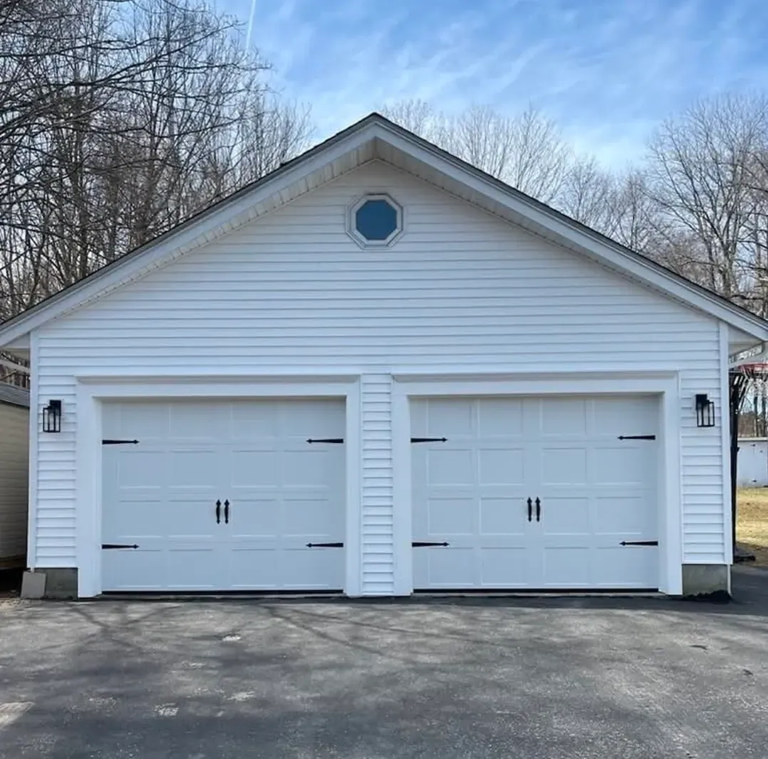 White carriage-style doors on a detached garage