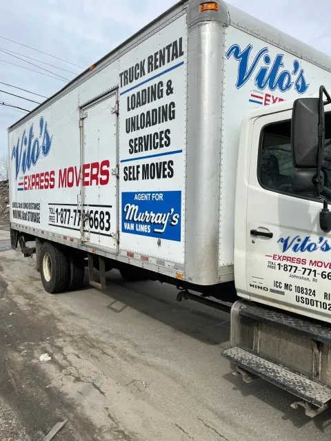 Vito's Express Movers box truck advertising loading, unloading and self-move services