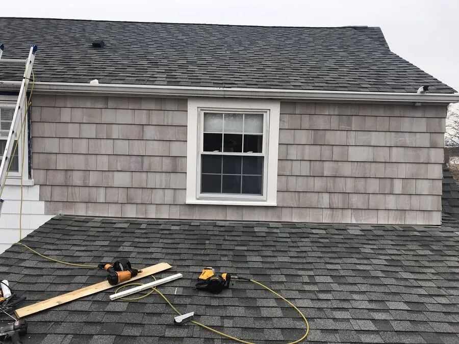 New window and shingle siding installation