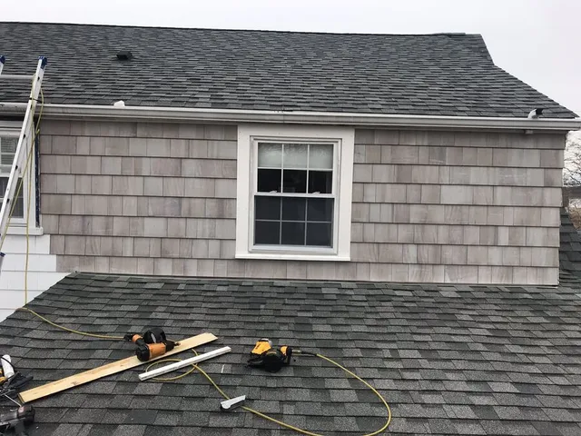 New window and shingle siding installation