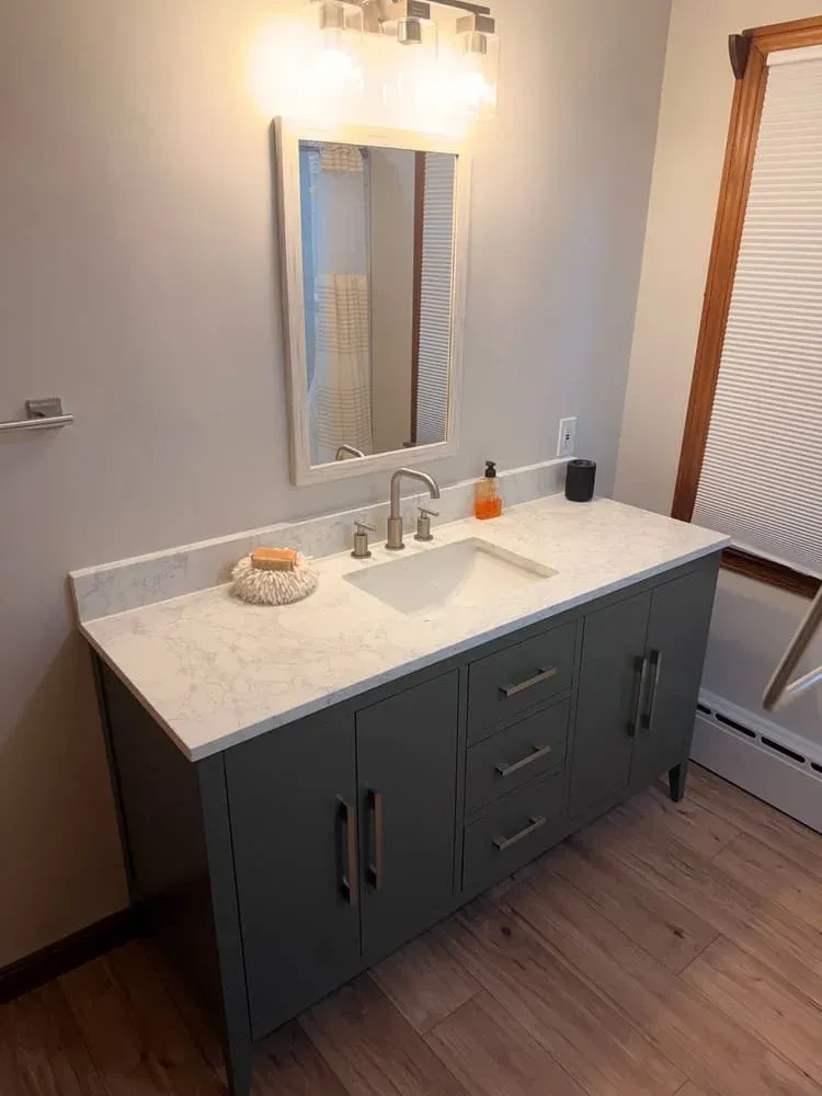 Recently completed tiled shower and bath
