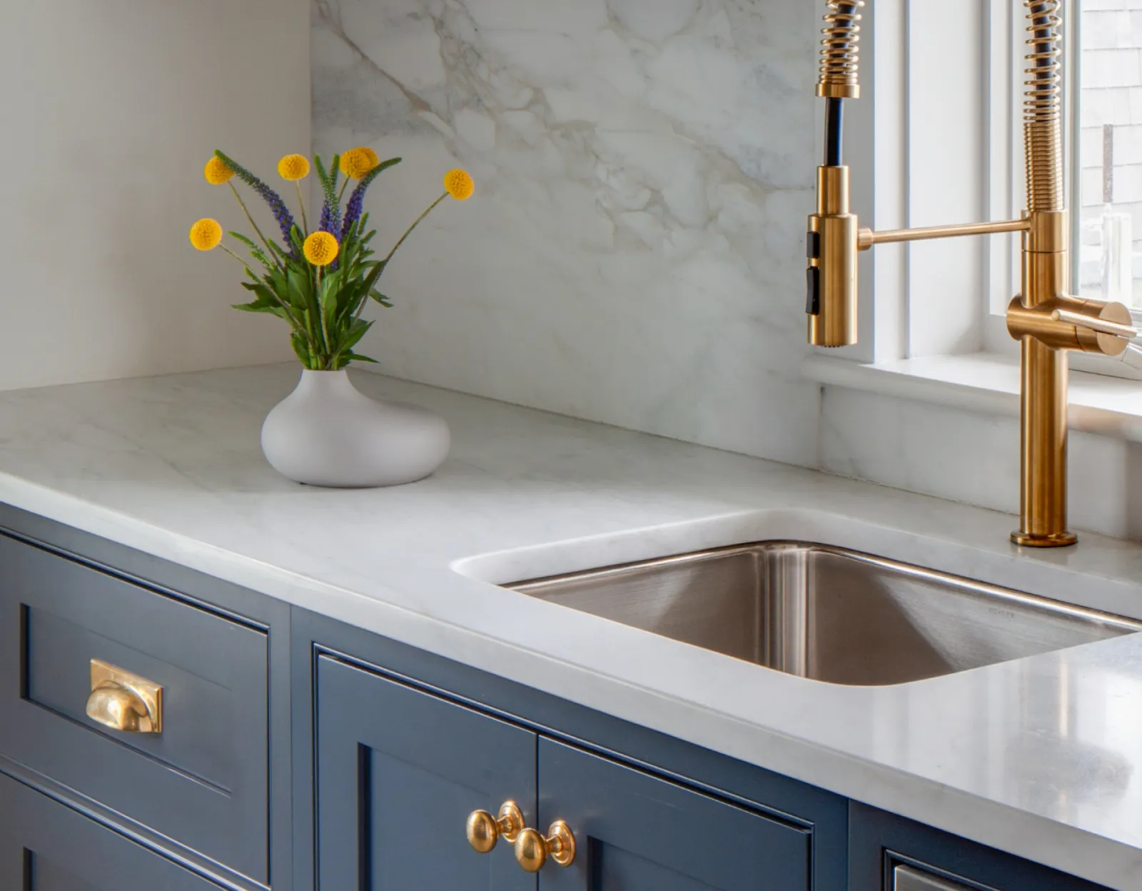 Blue Cabinetry with Marble Counter