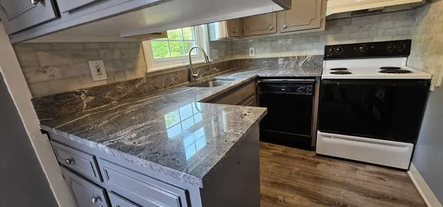 Kitchen remodel — granite counters and gray cabinets