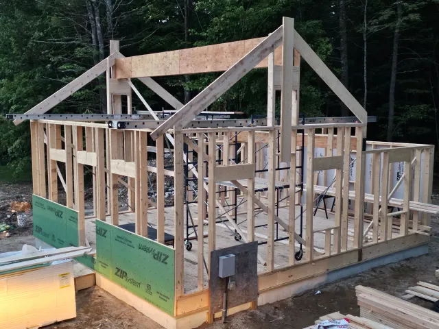 a wooden structure is being built with zip system