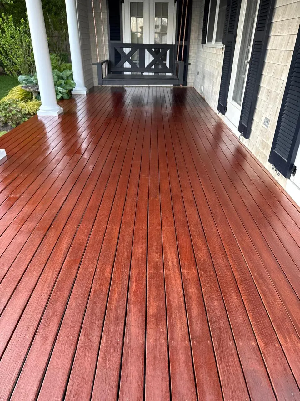 Restored outdoor wood deck by HMS Painting