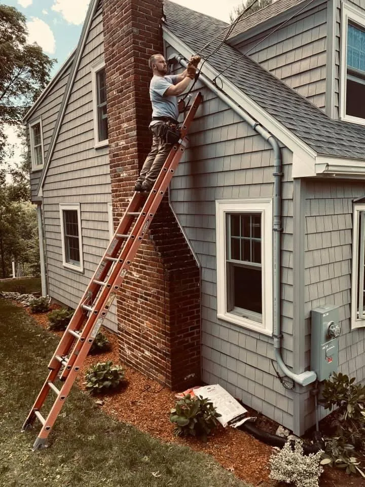 Ladder work on an exterior service entrance