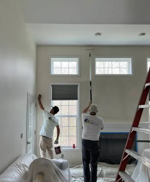 Two Fresh Home Painting painters cutting in a ceiling line