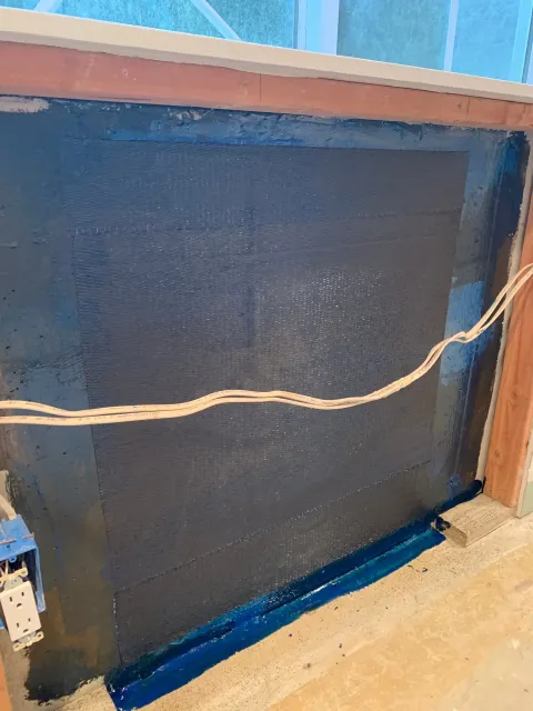 structural foundation crack repair with carbon fiber strap reinforcement near window opening in Armonk, NY — after