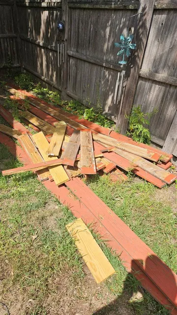 Deck boards stacked after an Alpha Haul deck tear-out