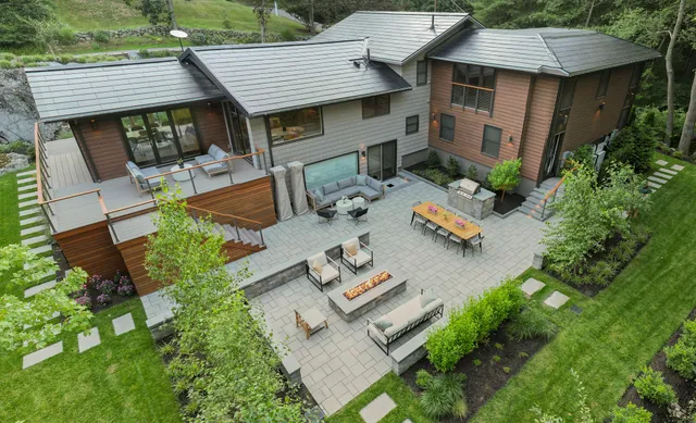 modern home, Tesla solar roof, fire pit, grill island, seating, pavers, walls, landscape lighting, plants