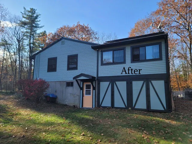 A beautifully restored New England home with a rich green exterior, a vibrant yellow door, and elegant dark green trim by Impeccable Painting.