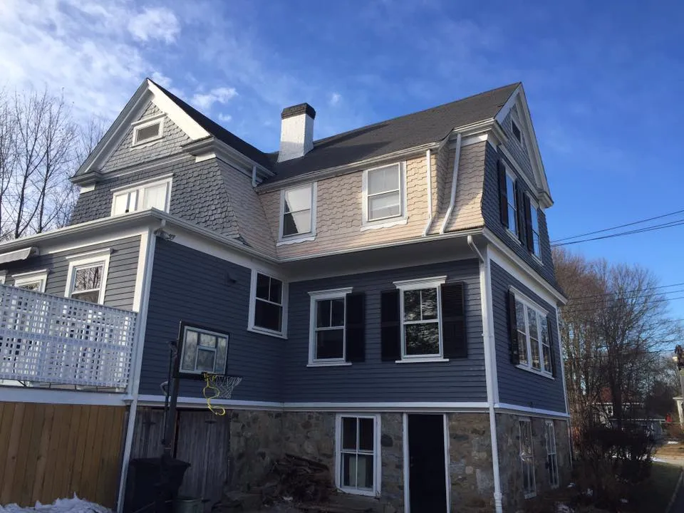 Completed roof, siding and trim on a three-story home