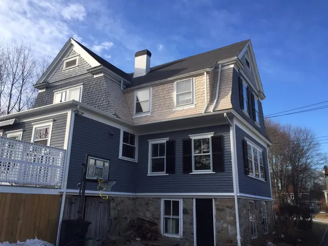 Completed roof, siding and trim on a three-story home
