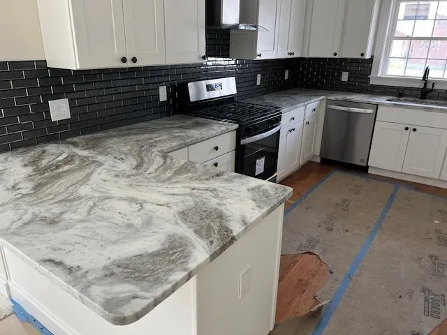 Kitchen renovation and home remodeling project in Worcester County, MA — Titan Builders LLC custom cabinetry, countertops, and home addition craftsmanship
