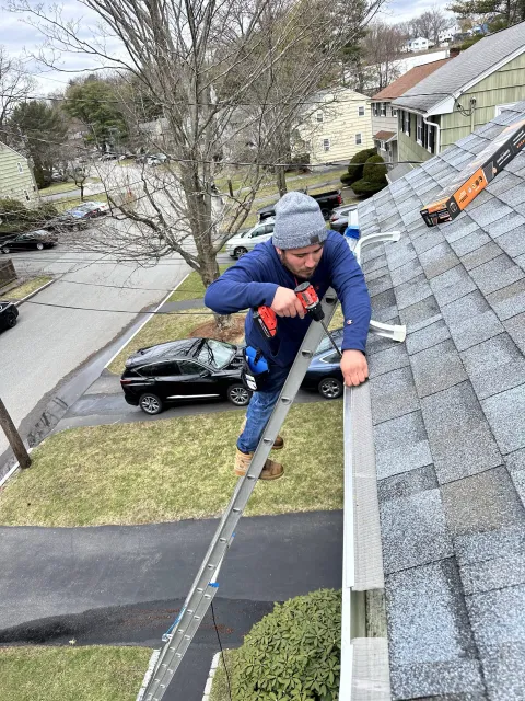 Windows Cleaning Expert professional installing gutter guards