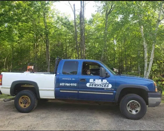 A Blue And White Truck With The Word Services On The Side — Brimfield, MA — RMD Services, Inc.
