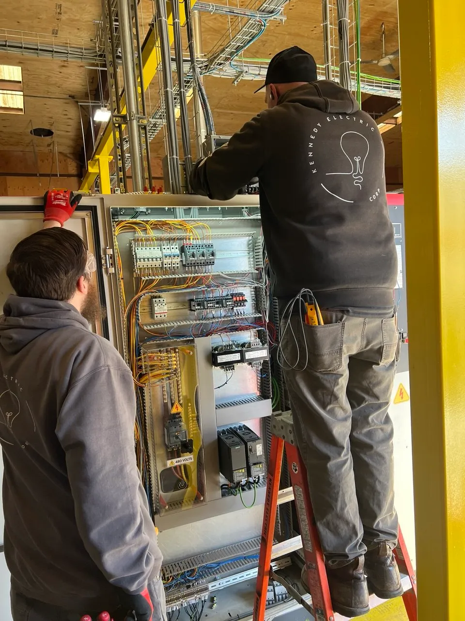 KEC team working on 480V controls cabinet