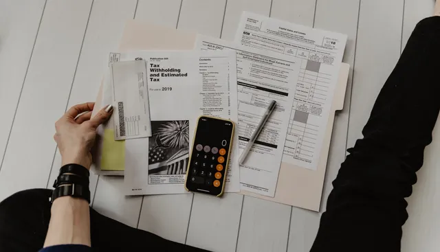 Homeowner reviewing energy bills and calculating rebate savings