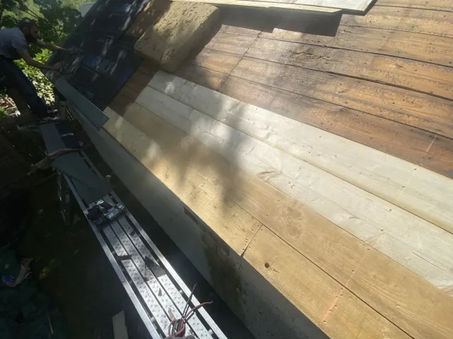 man working on roof
