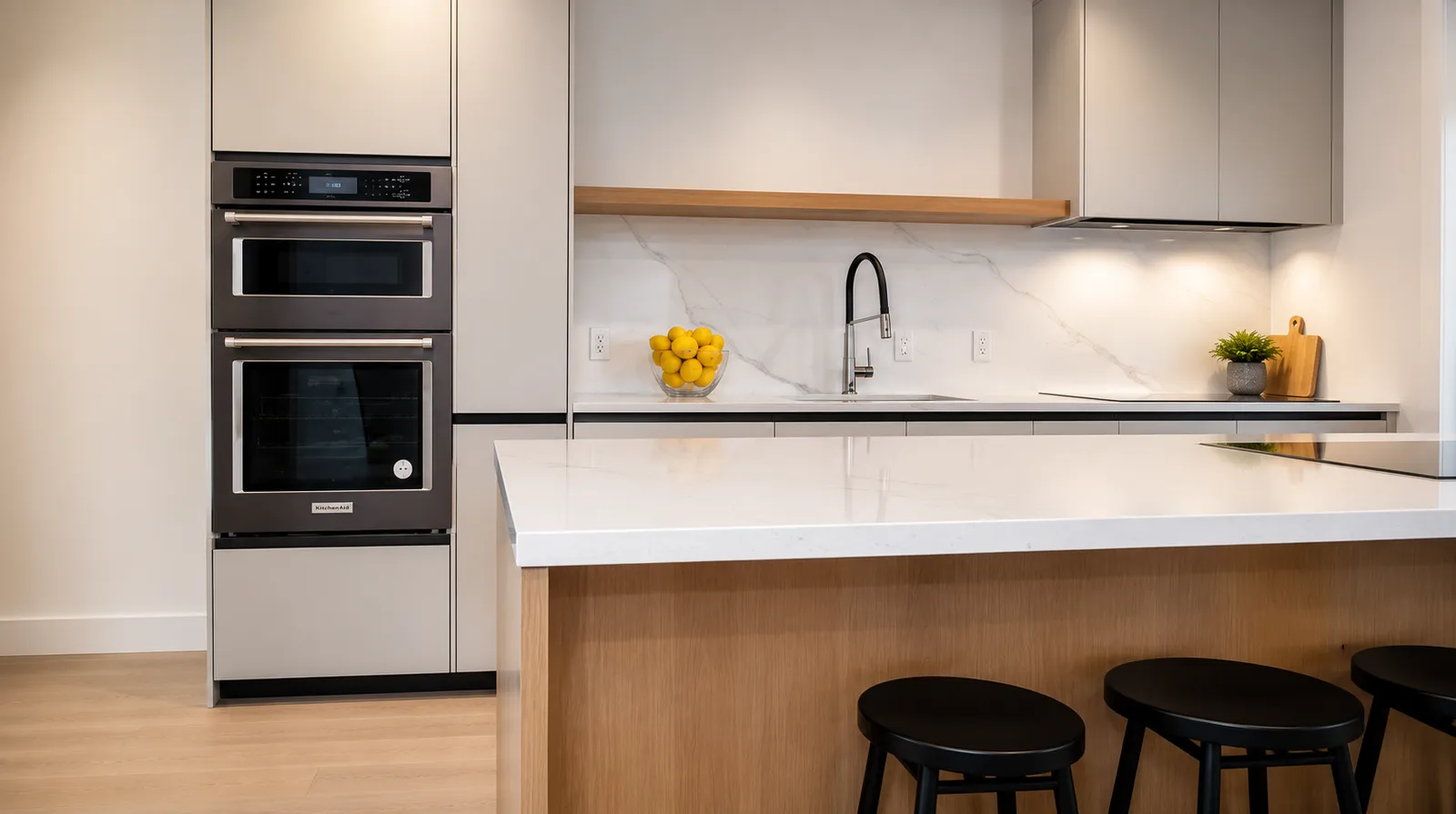 Modern kitchen remodeling project completed by Ocazo Construction in Cape Cod, Massachusetts featuring custom cabinetry, quartz countertops, and premium finishes.