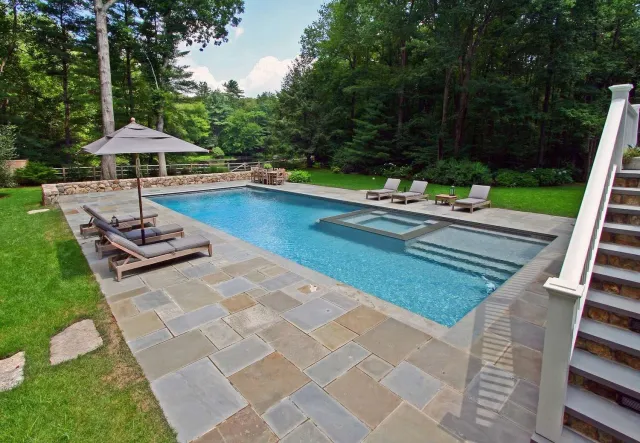 Swimming pool with new tile and coping after restoration in Greenwich, CT