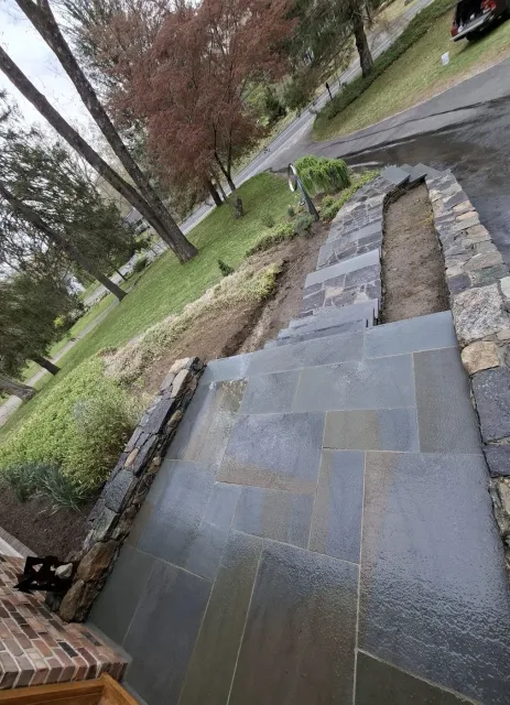 Bluestone steps and landing set into a stone wall