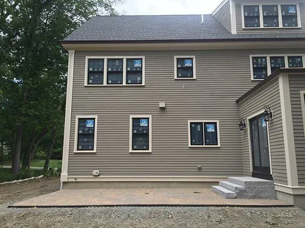 A house with a lot of windows is being built