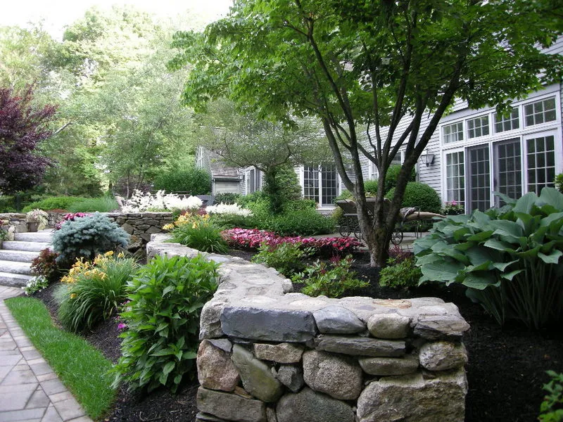 Fieldstone retaining wall with plantings