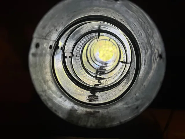 The same vertical dryer duct after cleaning, with daylight visible clearly straight through the run.