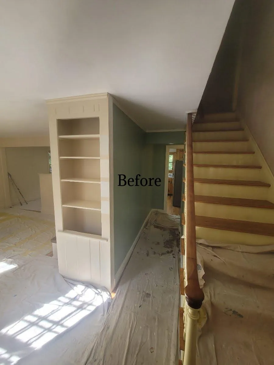 A front hallway with dull, faded green walls before being updated with a fresh new look by Impeccable Painting.