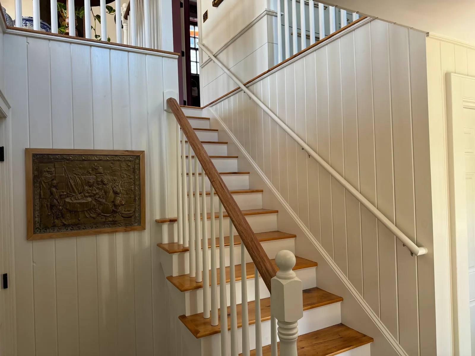 Restored staircase with painted paneling