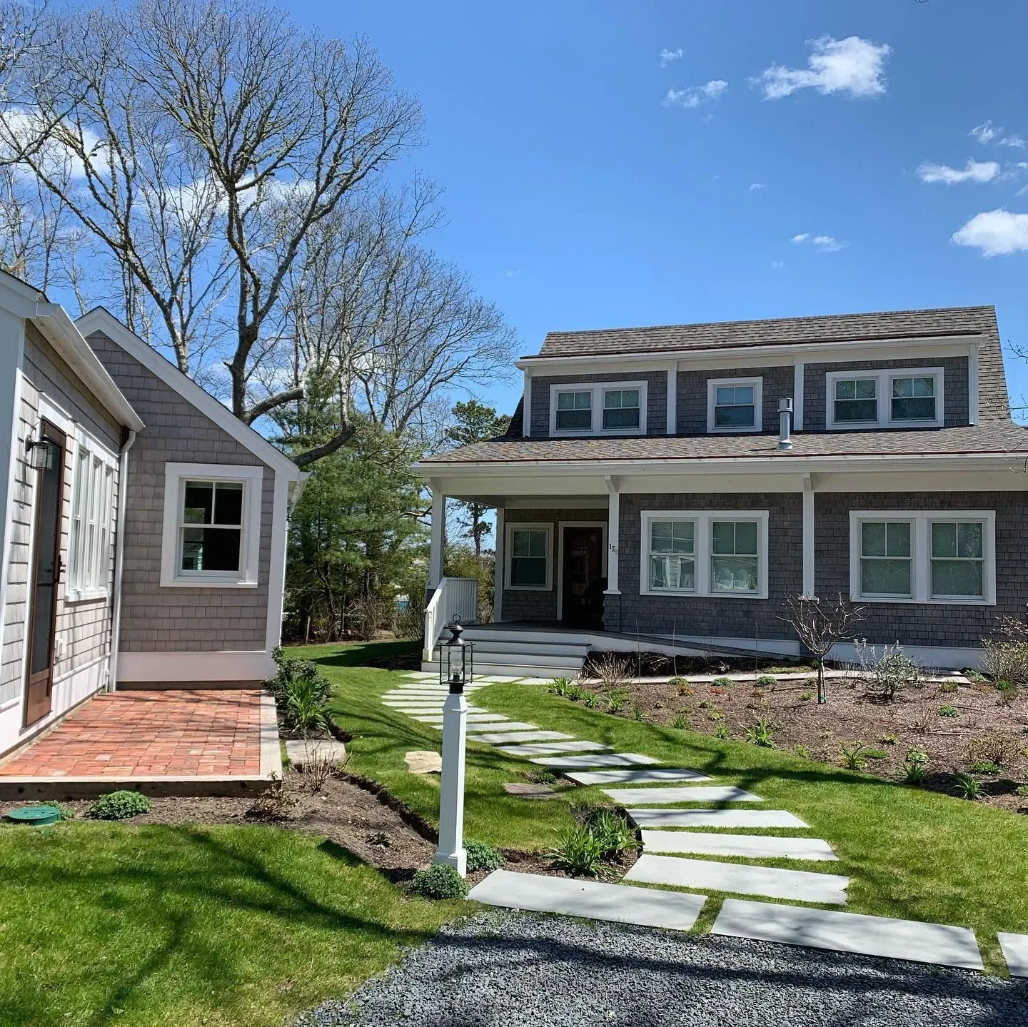 Freshly cleaned Cape Cod home exterior showcasing clean windows and front yard