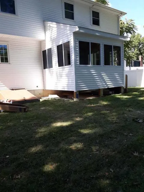 Rear addition with new siding and windows