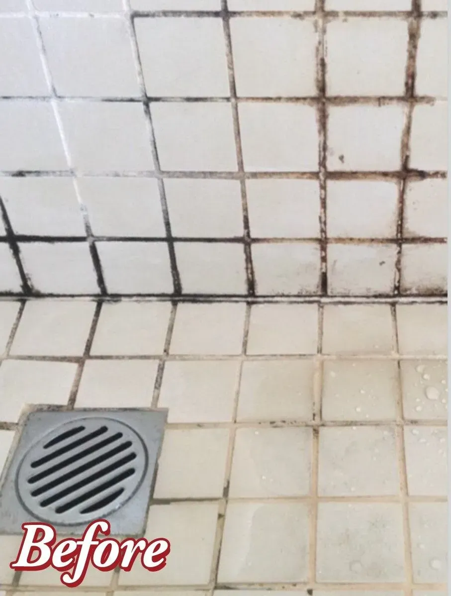 Accessible shower with built-in bench, grab bar, multiple shower heads, and tiled walls/floor.