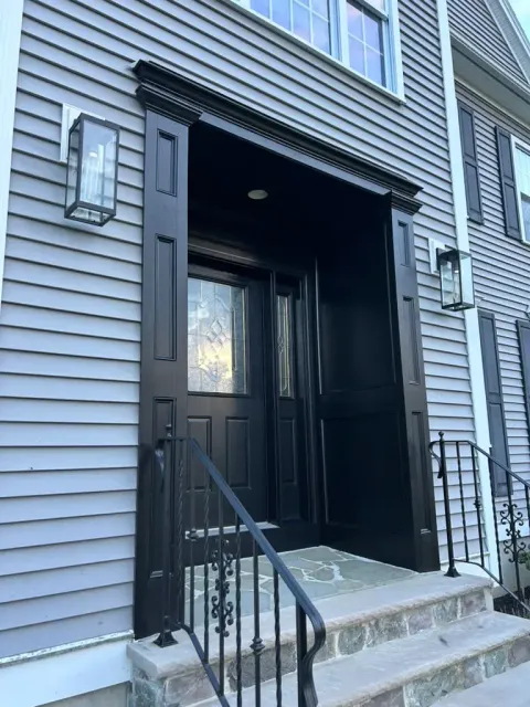 Freshly repainted black front entry viewed from the side