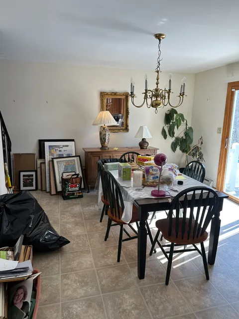 Cluttered dining room before junk removal