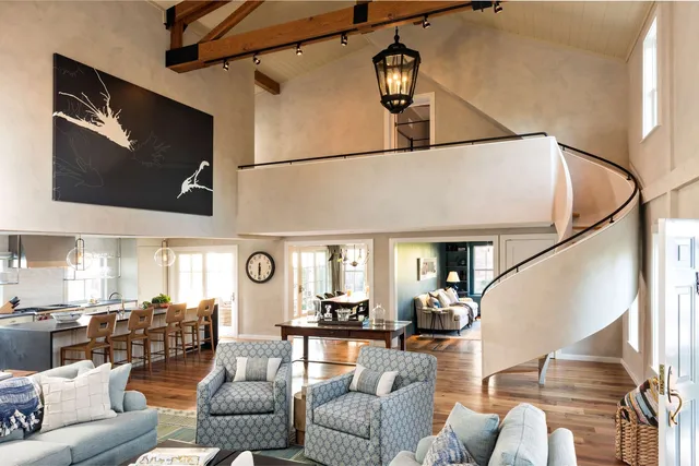 A striking before-and-after from this Cape Cod home renovation.

The transformation opened up the main living areas, introduced more natural light, and brought a cleaner, more cohesive feel throughout the home. A sculptural curved staircase now anchors the space, complemented by exposed timber beams, updated flooring, custom trim, a refreshed kitchen, and thoughtfully finished architectural details.

The result is a home that feels brighter and more refined while still retaining the character that made it unique.

Photography by Dan Cutrona

#CapeAssociates #CapeCod #CapeCodHomes #CapeCodRenovation #BeforeAndAfter #CustomHomeBuilder #CapeCodBuilder #HomeRenovation #Craftsmanship #CustomCarpentry #ArchitecturalDetails #CapeCodLiving #CoastalHomes