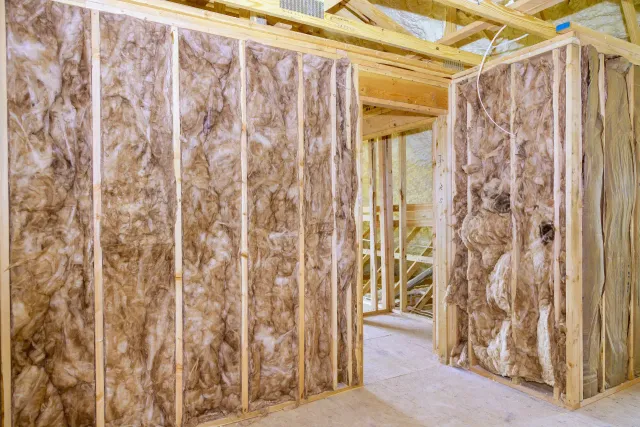 Fiberglass batt insulation installed between ceiling joists in Connecticut