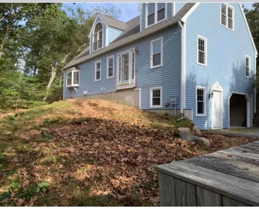 Blue house with open garage