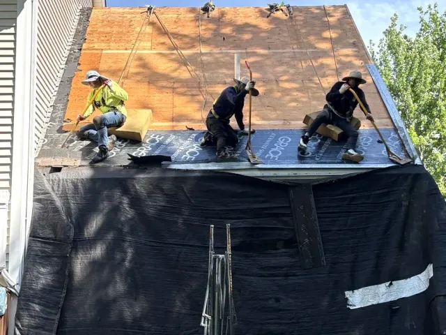 A-Z Roofing crew installing a full roof replacement