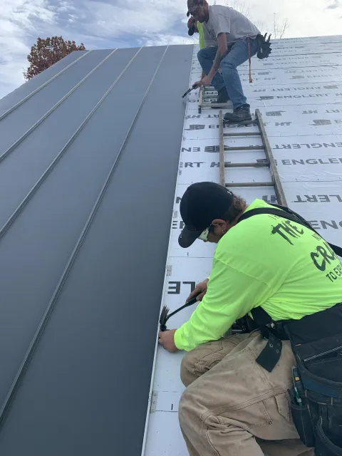 Rodd Roofing employee working on a new standing seam roof