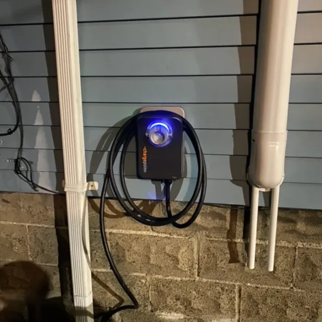 ChargePoint Level 2 charger energized on a home exterior